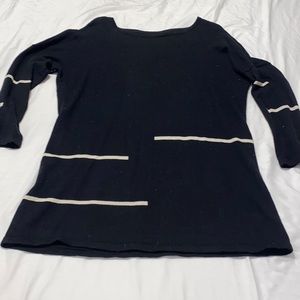 black sweater with white striped detail